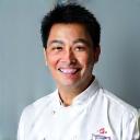 Headshot of Chef Wei Chen, a professional-looking man in his 40s.